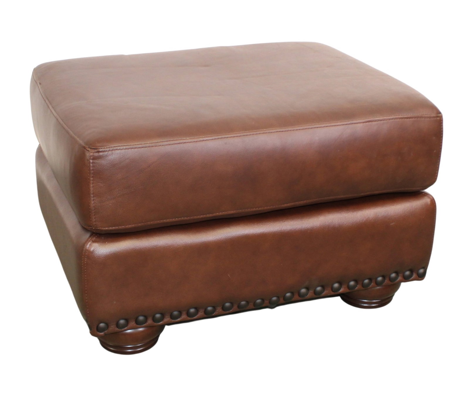 Pebble leather ottoman on bun feet with nail head trim (1 of 8)