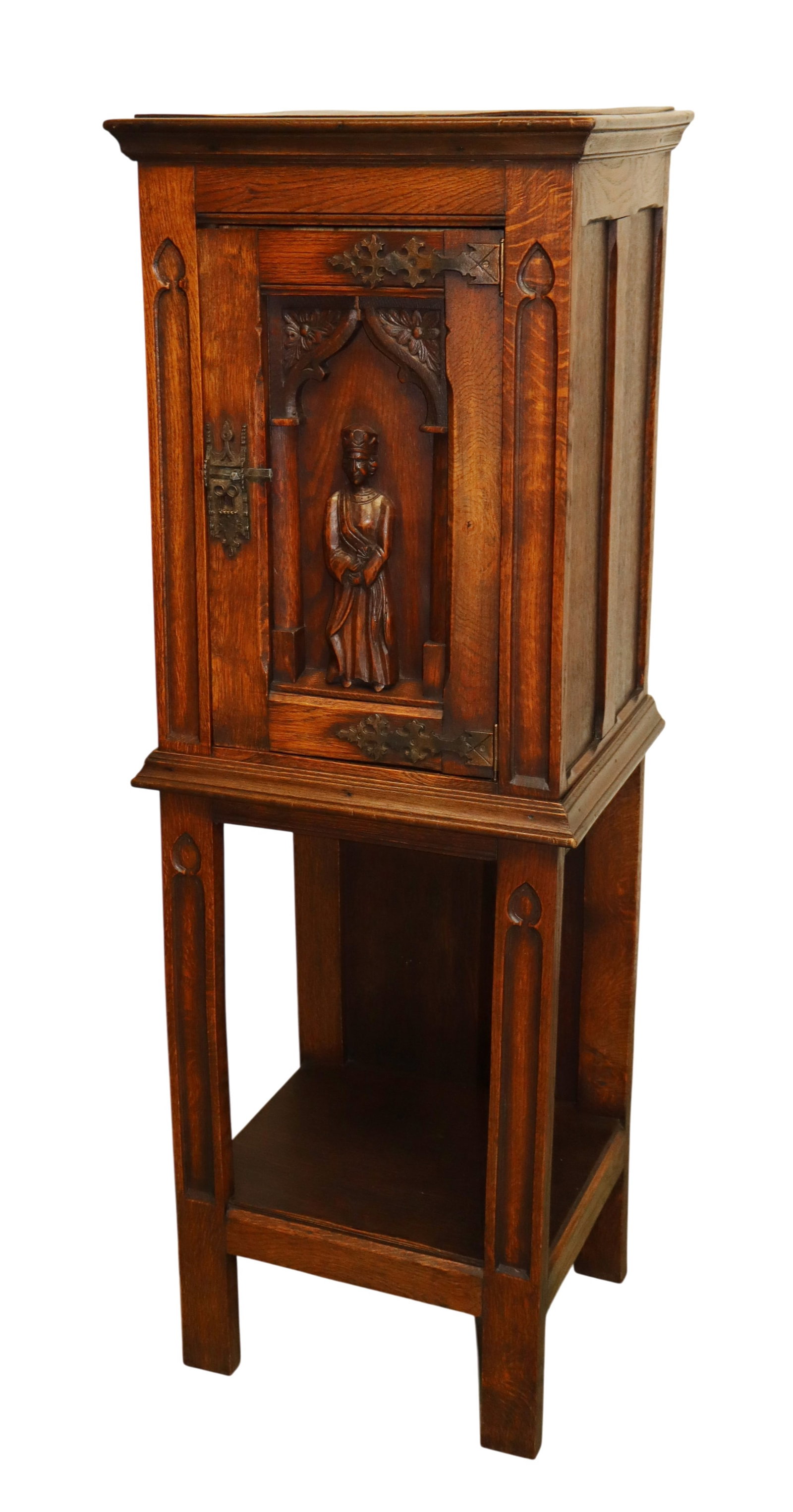 French Gothic Revival oak reliquary cabinet in oak: French Gothic Revival oak reliquary cabinet with relief carved bishop figure in oak. Mid 20th century. 50 1/2"h x 17 1/4"w x 14 1/2"d