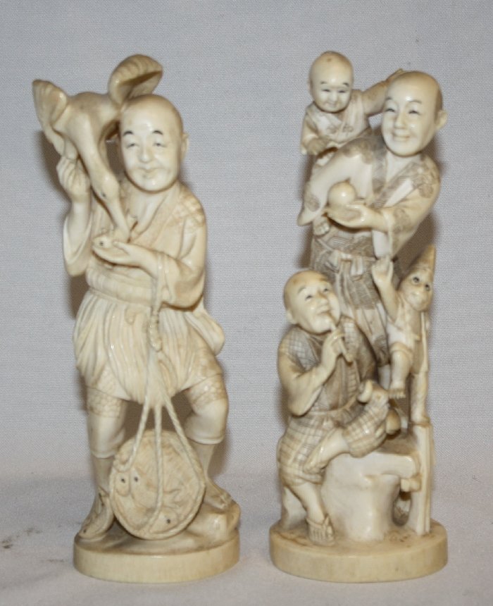 Lot of 2 Carved ivory statues-signed: Fisherman -7 1/2"h x 2 1/4"w x 2"d Grouping of performers 7 1/4"h x 2 3/4"w x 2 3/8"d *please note ivory cannot be shipped internationally*