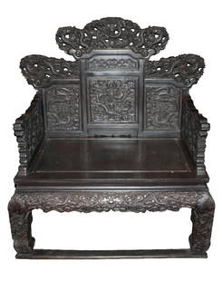 Chinese Zitan large throne Chair with dragons: Chinese Zitan large throne chair. Dense hardwood throughout, with a fine grain, elaborately carved surface- with dragons, foliage, stylized floral scrolling and rococo elements. Five imperial five-toe