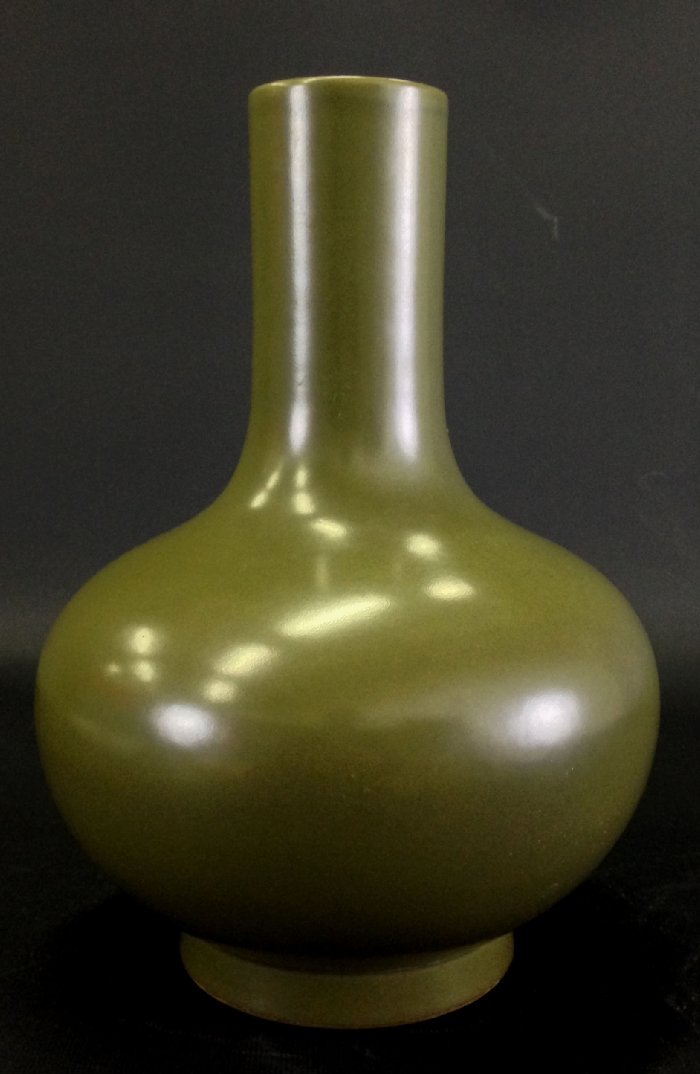 Chinese dark olive green monochrome vase: Chinese dark olive green monochrome vase , simple bulbous-form body with long slender neck on circular platform base, impressed six character QianLong Reign Mark, 13-5/8 in., good condition. Measureme