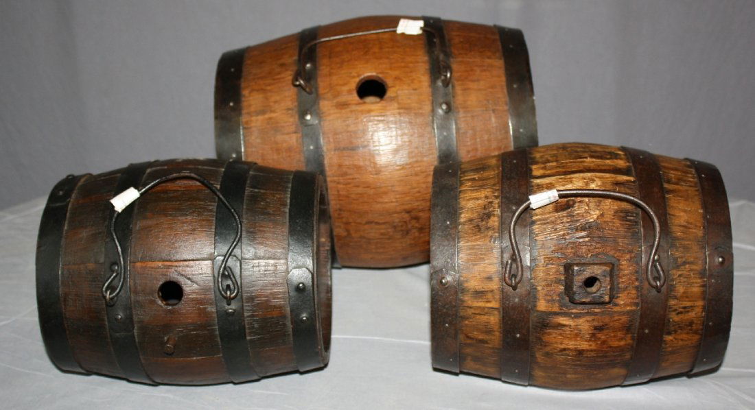 Lot of 3 French mini wooden barrels: ranging in size from 9 1/4"l-12 1/5"l x 7 1/2"dia - 10 1/4"dia