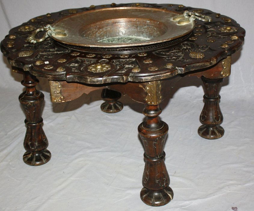 18th century Portugese firepit decorated with armory: and scallop shells. Relief carvings of armory & brass scallop shells throughout. Scallop shells representing the route of St Jacques de Compostell.21 1/2"h x 37"diam