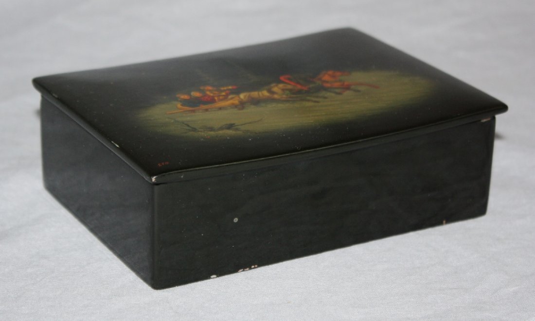 Russian lacquered and hand painted trinket box: Scene of horse drawn carriage. Artist signed. 2"h x 6 1/8"w x 4 1/2"d