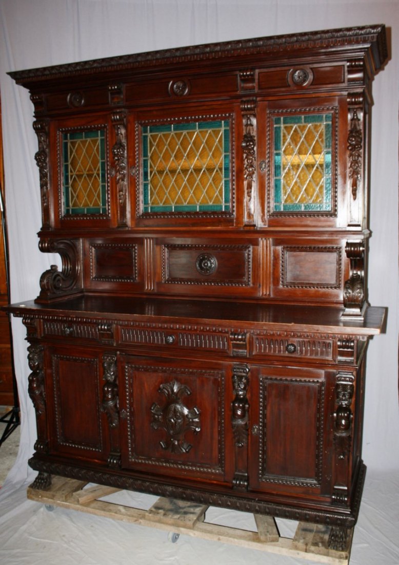 Italian Renaissance carved walnut buffet: with leaded glass doors and carved paw feet. Late 19th century. 92 5/8"h x 78 3/8"w x 24 5/8"d