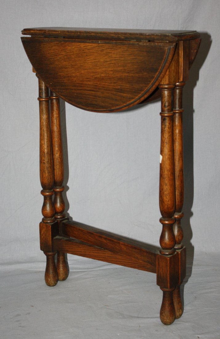 Small oak folding dropside table. 24"h x 15 1/2"w x 15": Small oak folding dropside table. 24"h x 15 1/2"w x 15"dia (open)