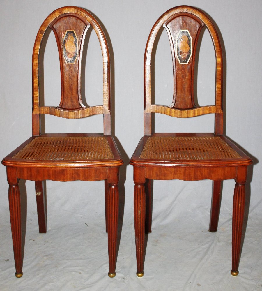 Pair of Art Deco caned seat marquetry side chairs: Pair of Art Deco caned seat side chairs with floral inlay. 37 1/2"h x 14 1/2"w x 17"d