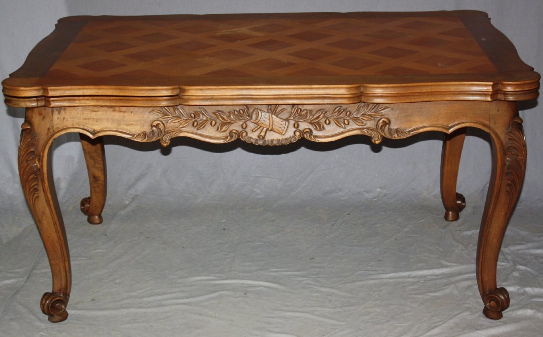 French Louis XV dining table in walnut with parquet: French Louis XV dining table in carved walnut with parquet top. Early 20th century. 30"h x 59"l (97 1/4"l w/ leaves) x 39 1/4"w