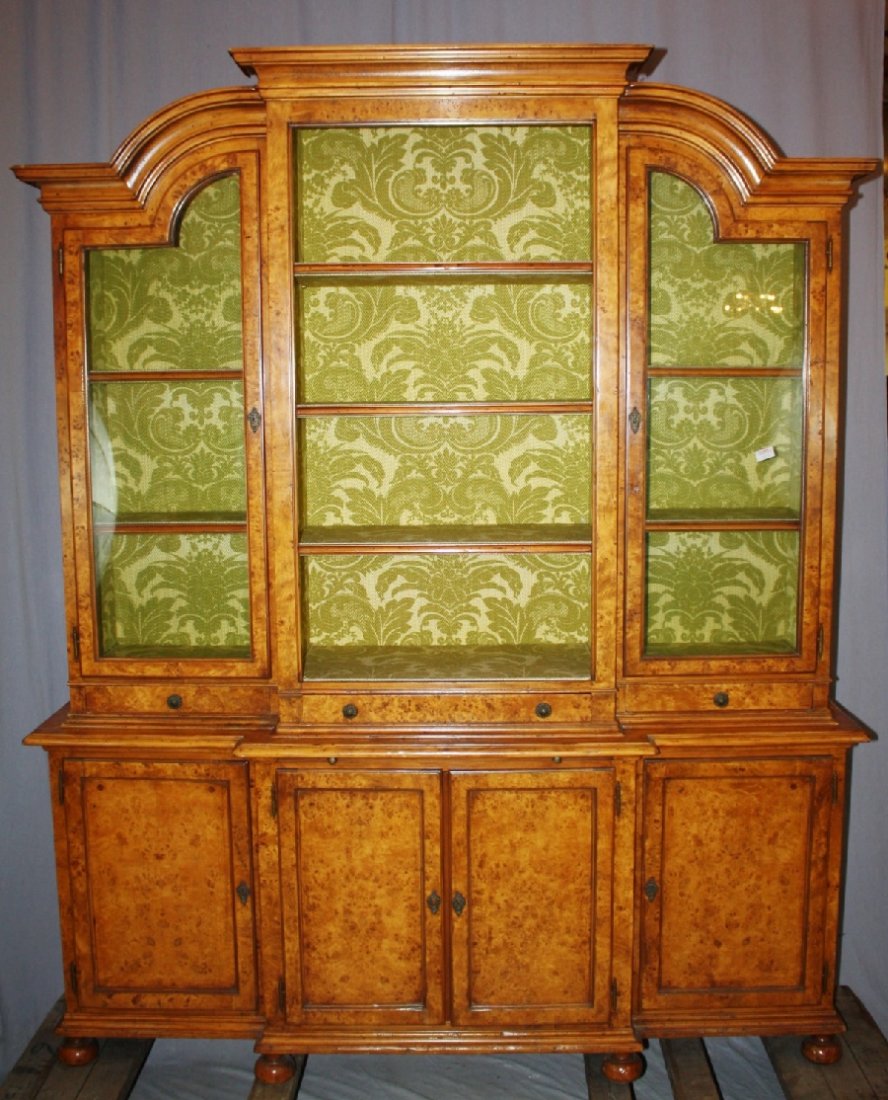 English burled elm breakfront bookcase. Early 20th: English burled elm breakfront bookcase. Early 20th century. Center shelves are open, side cabinets have glass doors. 69 1/4"w x 85"h x 16 1/2"d