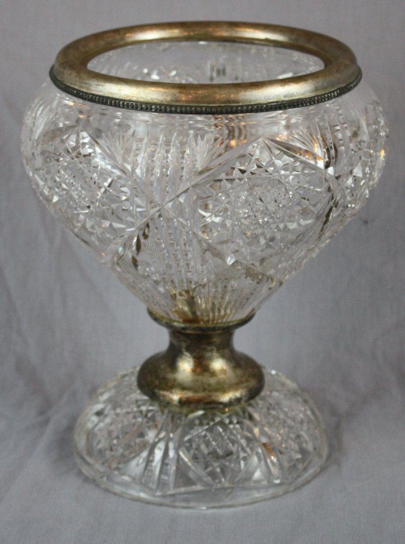 Cut crystal footed compote with silver ring: Cut crystal footed compote with silver ring (unmarked) 9 1/4"h x 7 3/4"diam