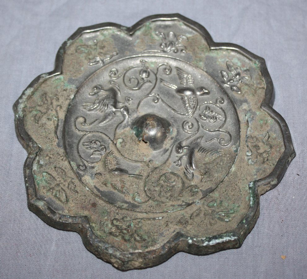 Chinese Bronze relief plaque: Chinese Bronze relief plaque, flowers shape rim. 4 3/4"dia