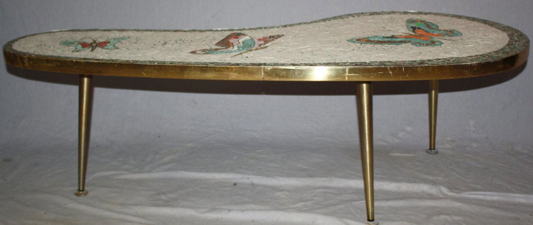 Vintage mid-century brass & mosaic top table: Kidney shape with butterflies. On 3 brass tapered legs. 15 1/2"h x 49"w x 22"d