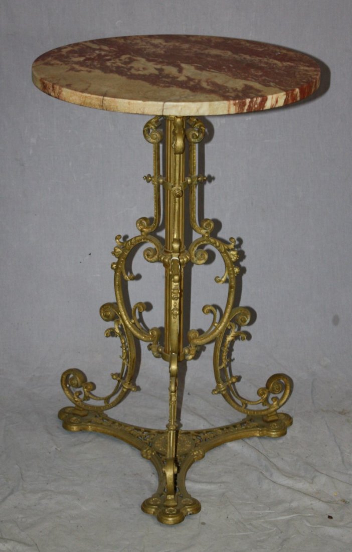 Victorian bronze base gueridon with marble top: Ornate scrolled bronze base gueridon table with marble top. Early 20th century. 29 5/8"h x 19 1/4" dia