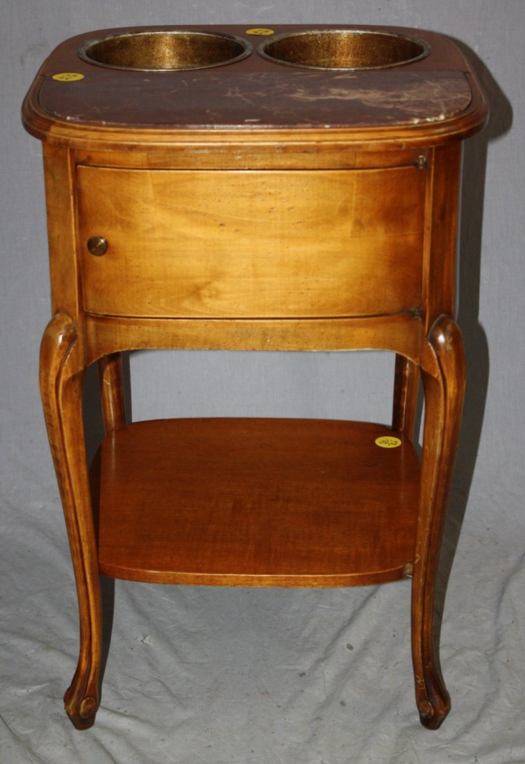 French Louis XV style walnut wine serving table: Early 20th century. Known as a 'table rafraichissoir' in French, this charming small table has 2 wine buckets used for keeping wine or champagne chilled and close by. 27"h x 18 1/2"d