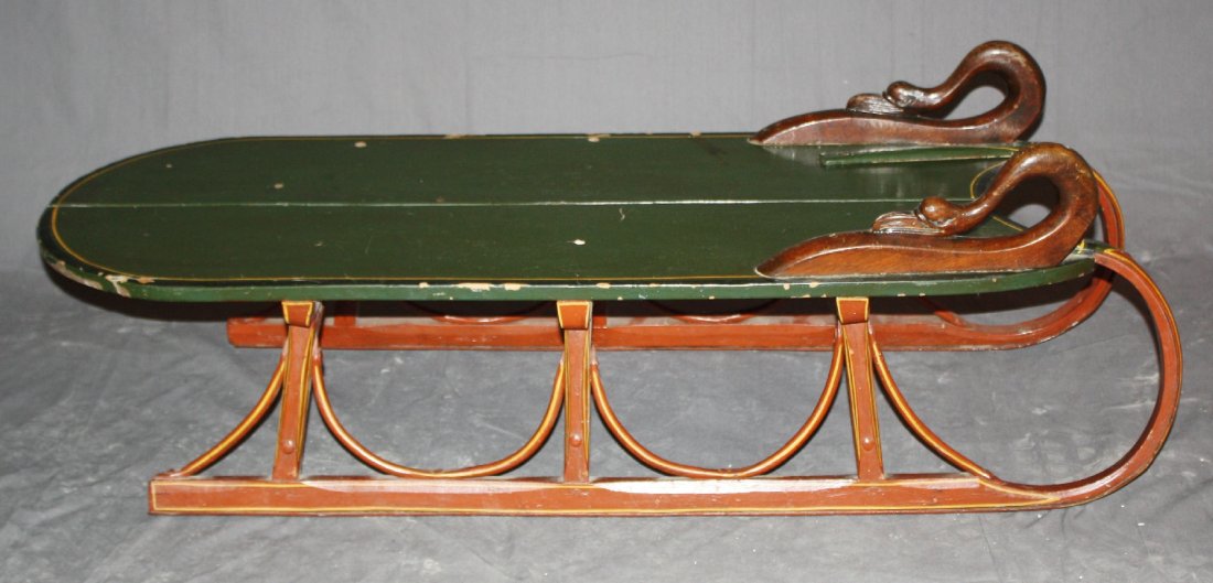 19th century painted wooden sleigh: with swan neck handles. 46"l