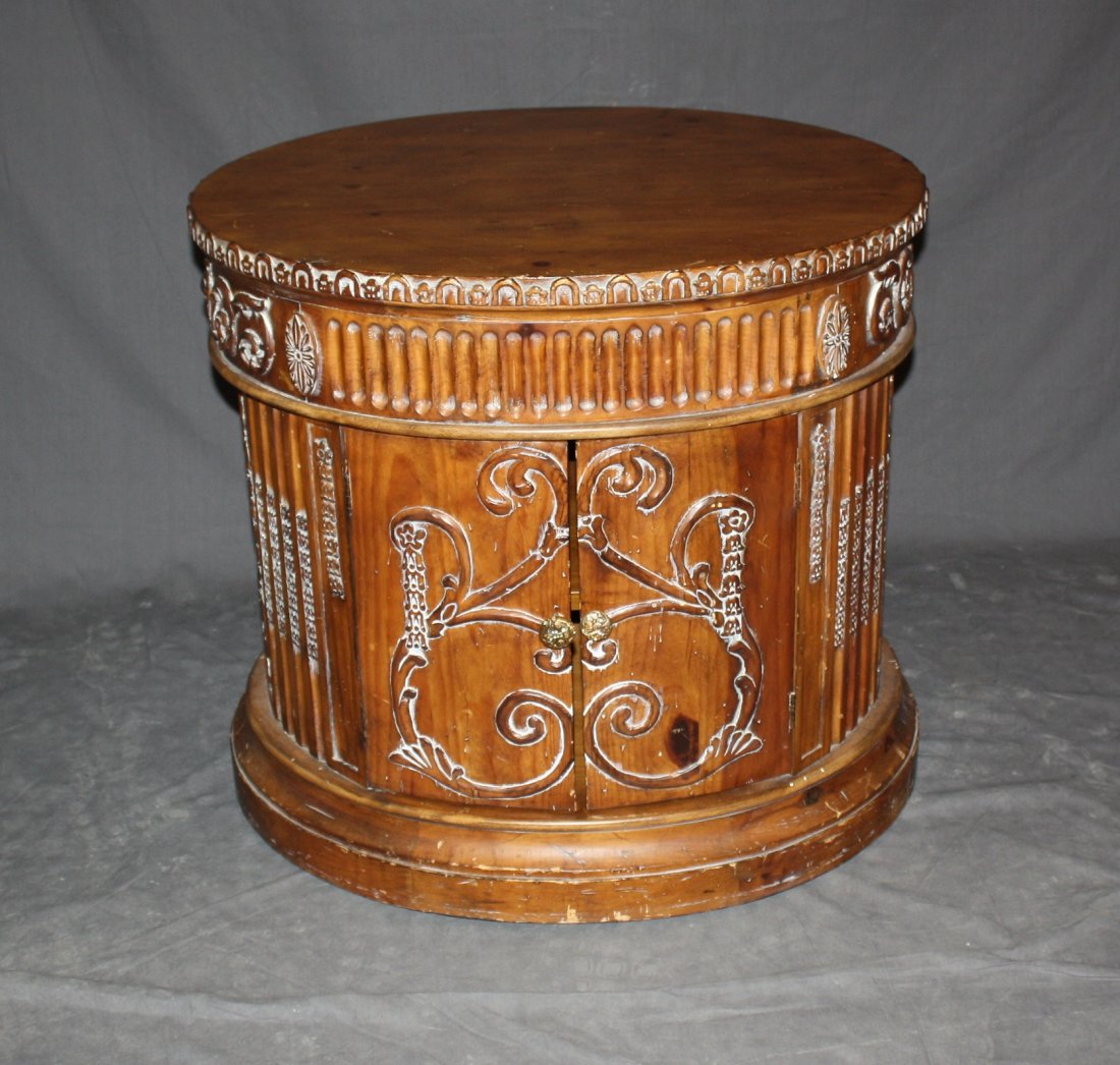Drum table with relief carvings: 2 doors. 25"h x 27.5"l x 23.75"w