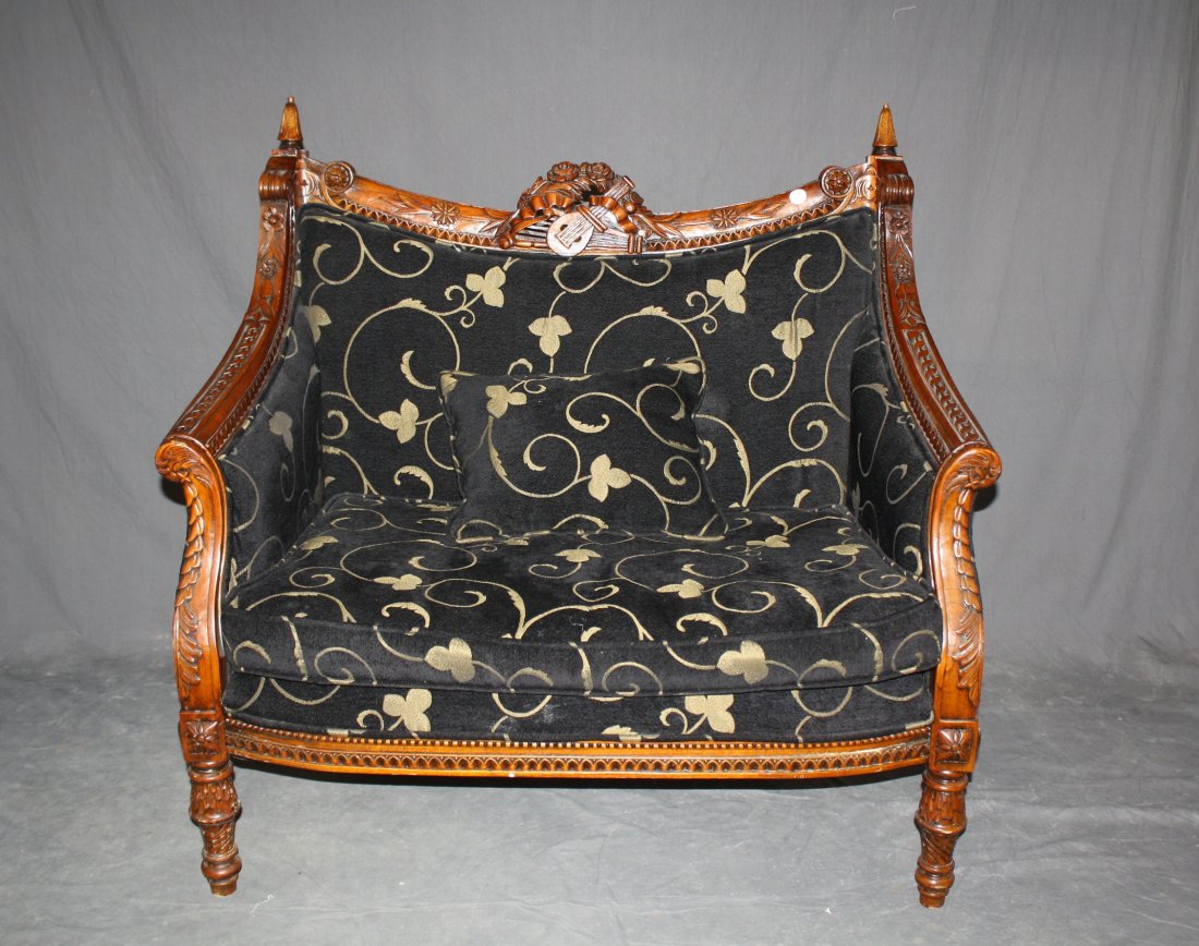 Carved mahogany settee with a musical motif: Upholstered seat and back. 40"h x 42"w x 24"d