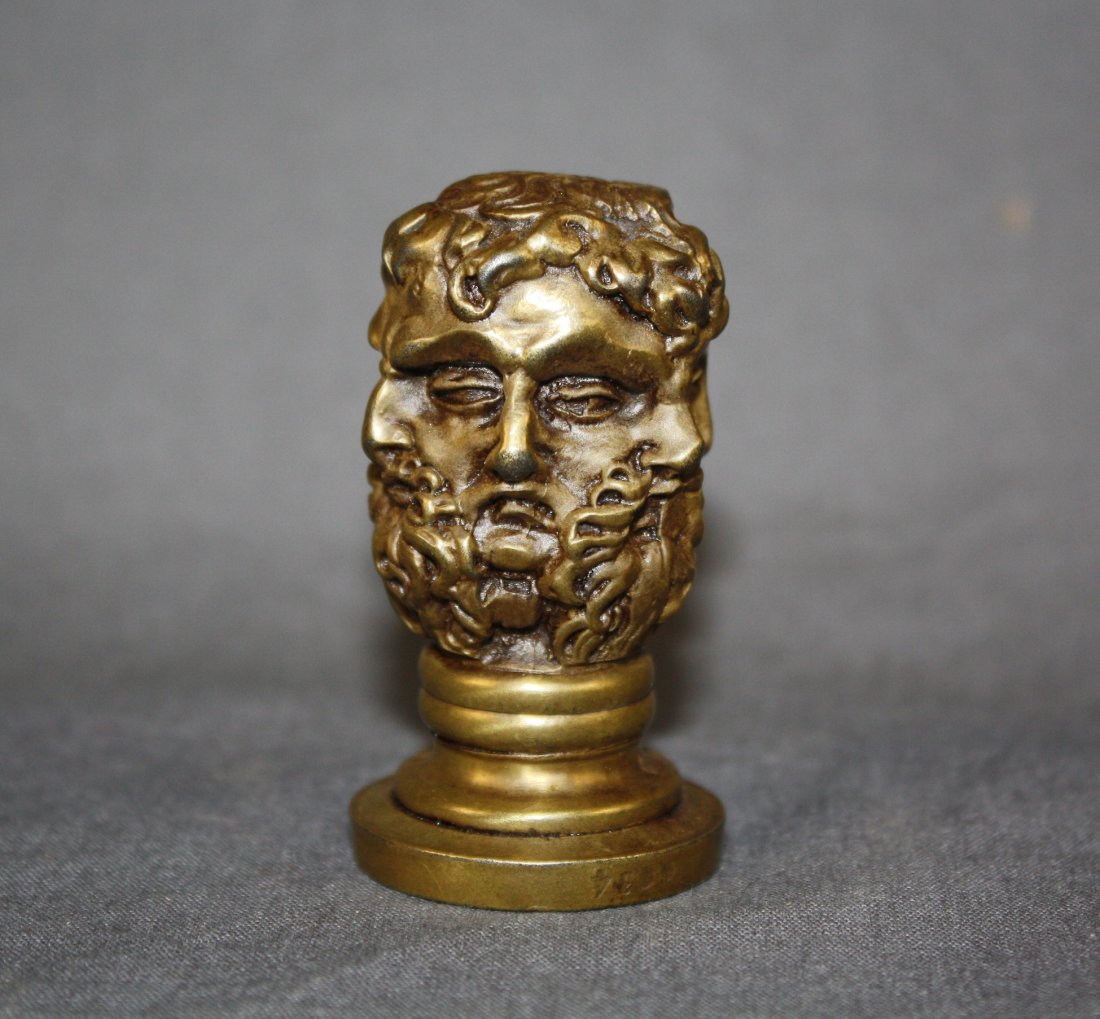 French bronze seal cast as a group of classical masks: Late 19th century. Seal face with intaglio design of crowned eagle with inscription, P.J. Monvoisin No're A Vichy tr. de Paix De Cusset (Allies). 2 3/8"dia