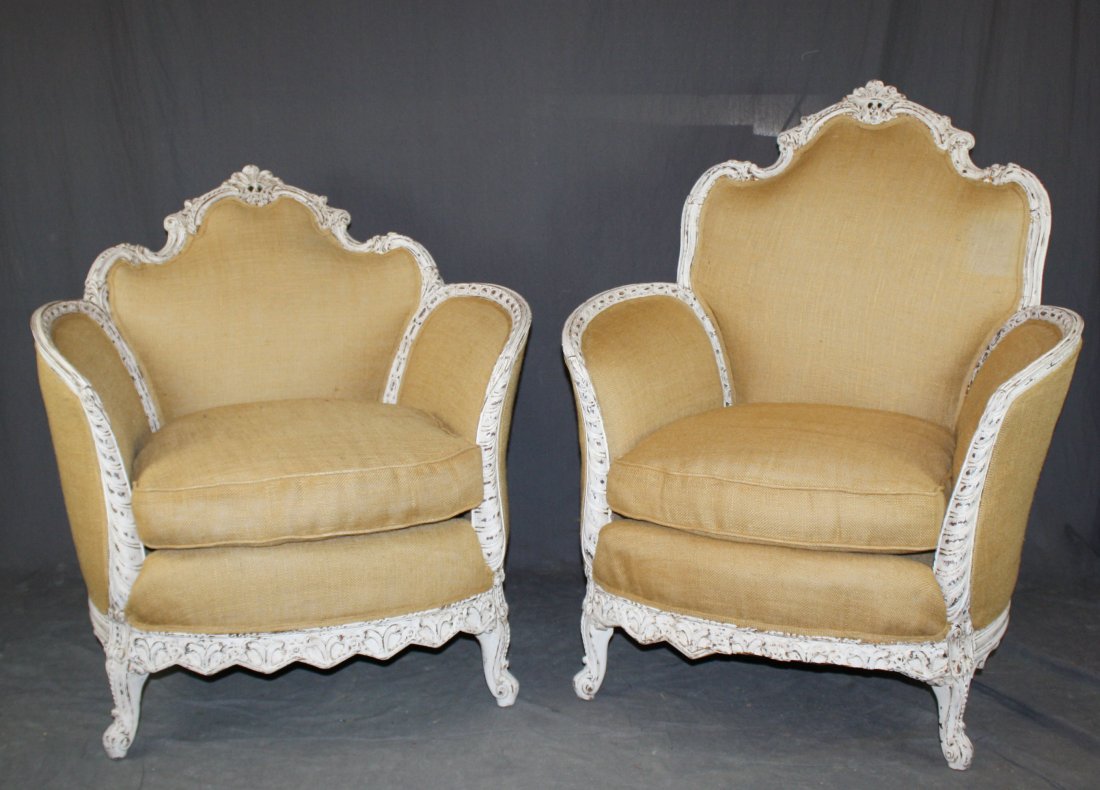 Companion pair of Louis XV style curved bergeres: Each with painted frames and burlap upholstery. 42"h & 35"h