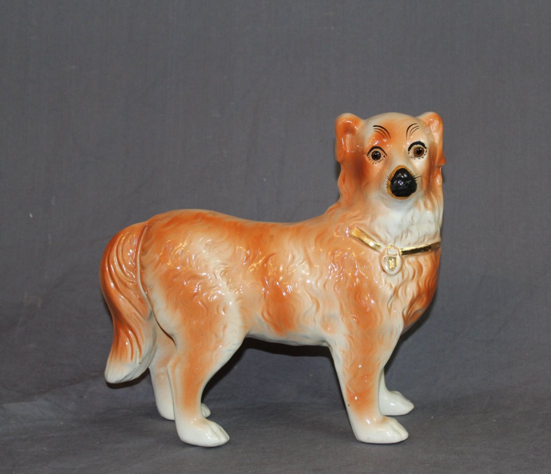Staffordshire retreiver figurine: Staffordshire retriever figurine. 11"h x 11.5"l x 4"d Provenance: Estate of Arthur Smith, New York.