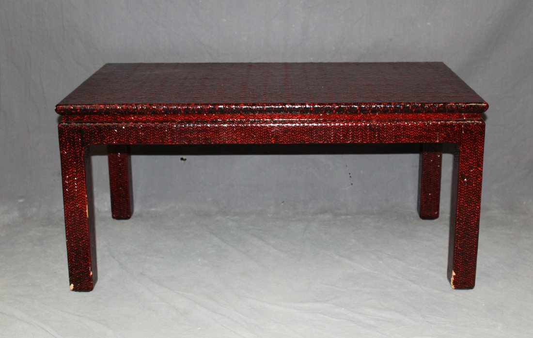 Vintage Japanese red laquered rattan cocktail table: Vintage red laquered rattan cocktail table. Made in Japan. 17.5"h x 36"w x 20"d Provenance: Estate of Arthur Smith, New York.