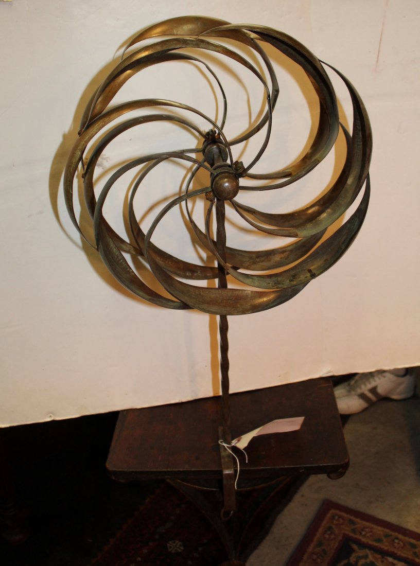 Copper garden whirly gig: Copper garden whirly gig. American. 20th century. On post with mounting bracket to attach to a table or counter surface. 27"h x 15.5"dia