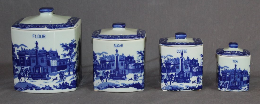 Lot of 4 blue & white ironstone cannisters: A set of 4 blue & white Ironstone cannisters: flour, sugar, coffee & tea. Ranging in height from 4.5"h - 8"d