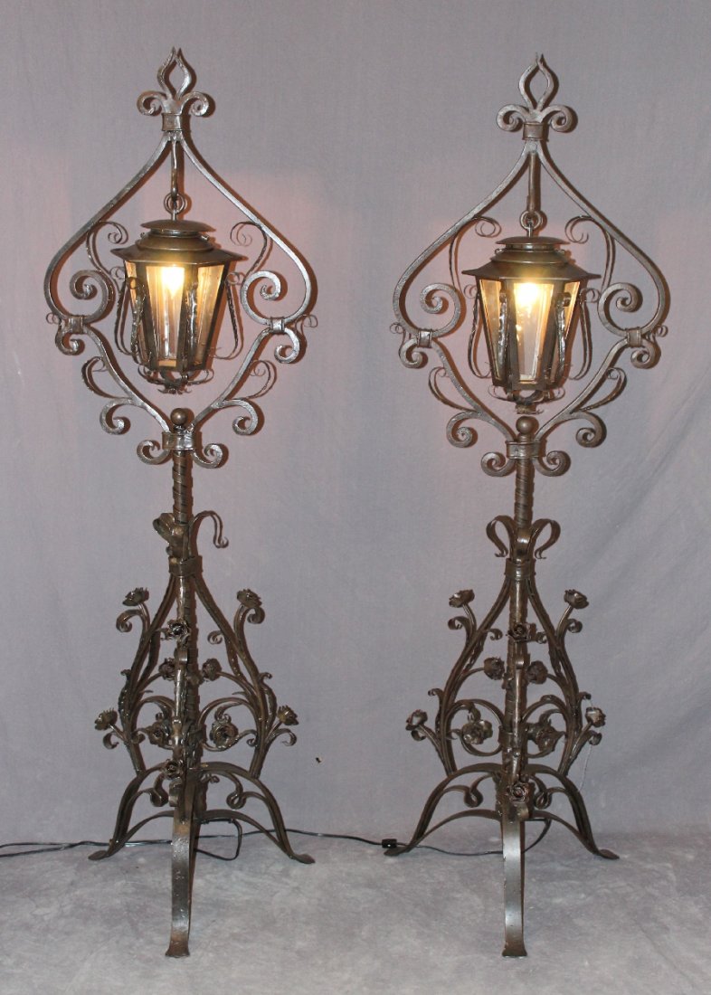 Pair of iron lanterns on ornate scrolled stands (1 of 5)