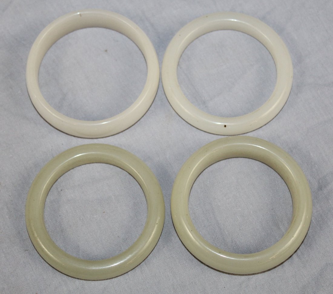 Grouping of 4 jade bangle bracelets (1 of 3)
