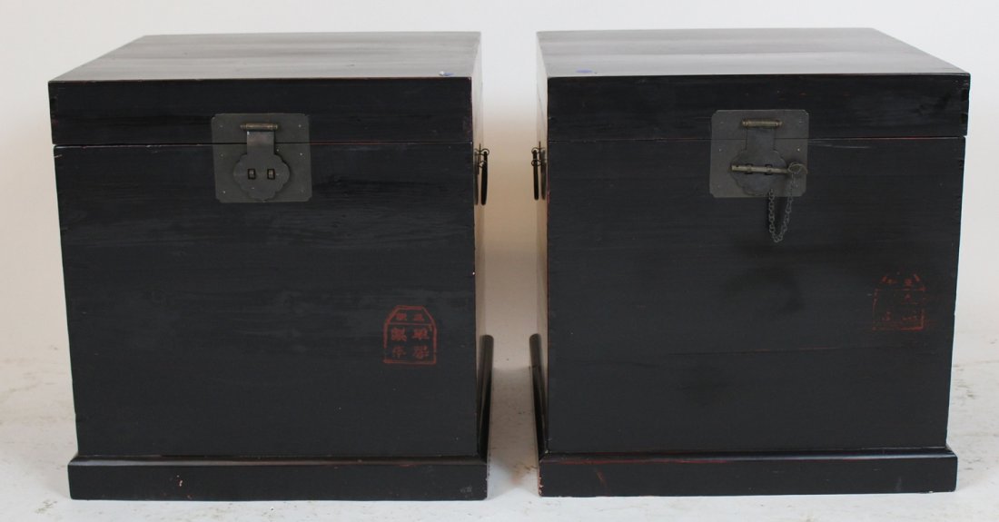 Pair of black Oriental cube form trunks (1 of 3)