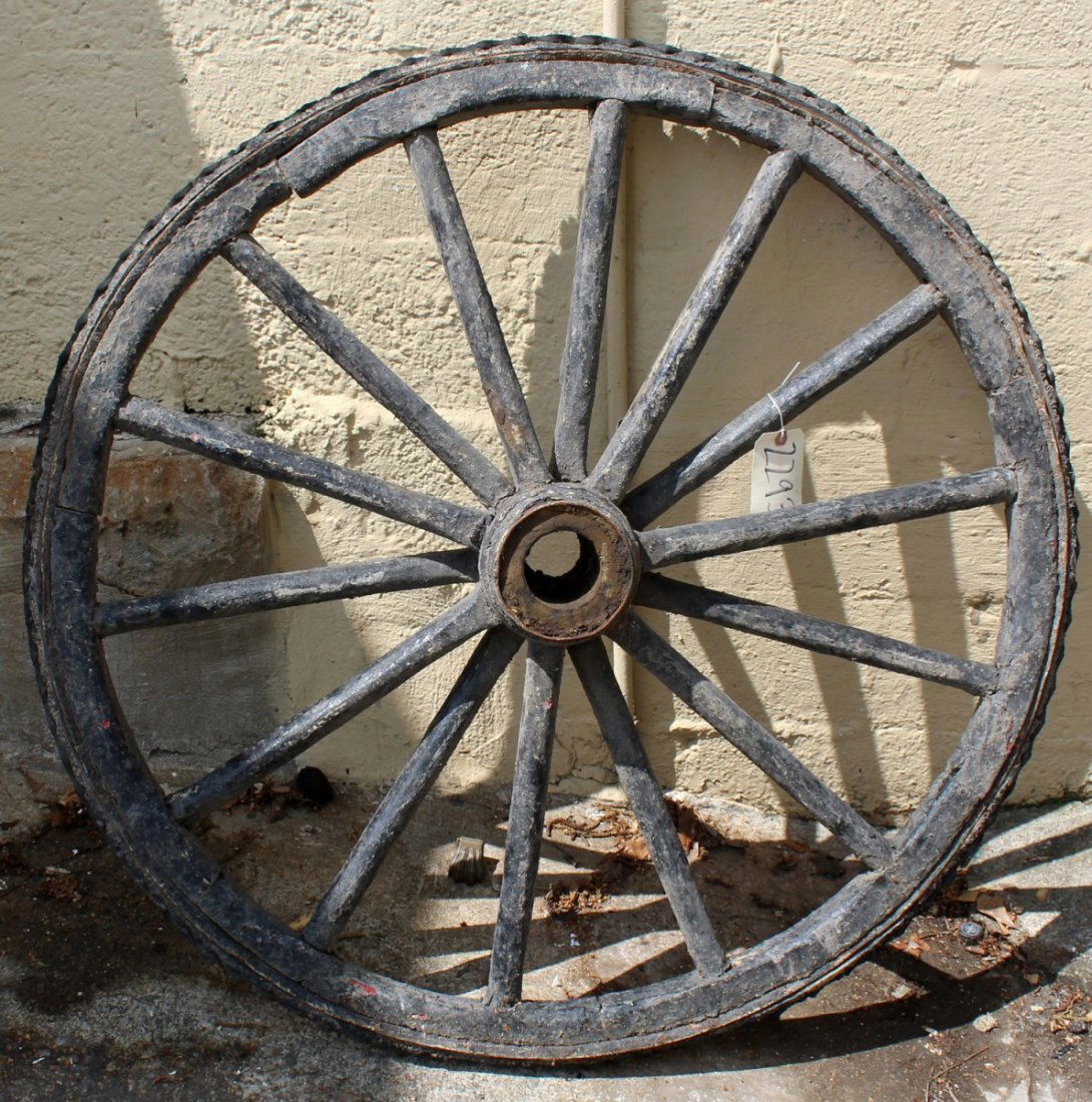 Antique wooden wagon wheel. (1 of 2)