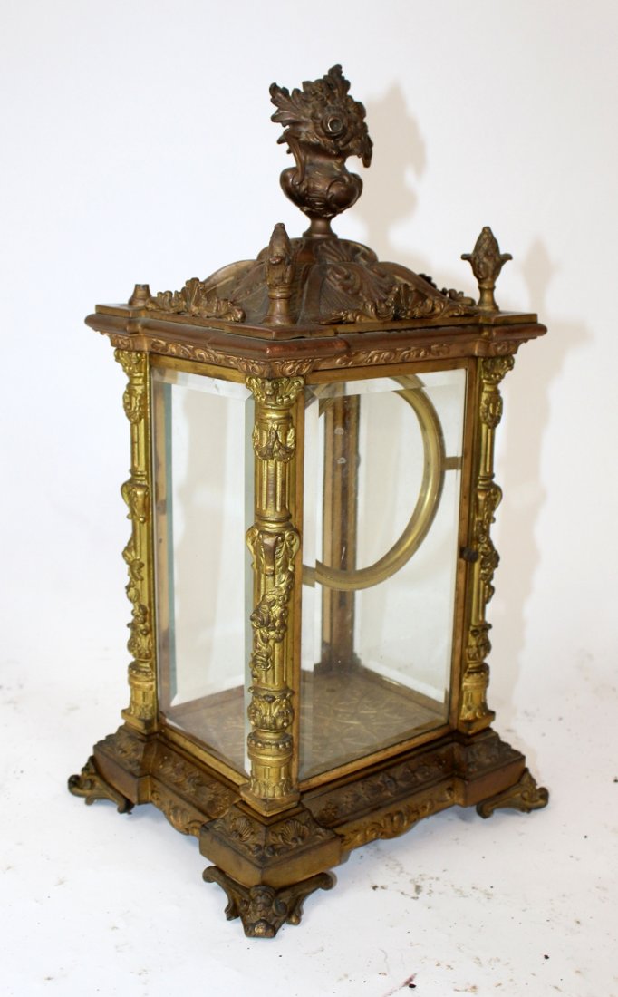 Bronze & beveled glass clock case: Bronze & beveled glass clock case with focal flowering urn. 16"h x 8 1/4"w x 7 1/4"d
