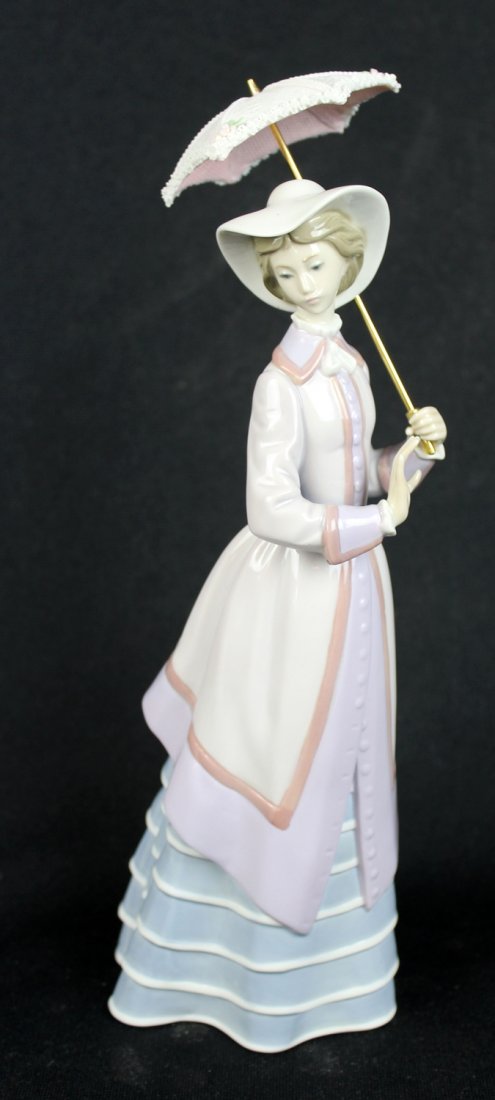 Lladro porcelain figure of a lady with parasol.: Lladro porcelain figure of a lady with a parasol. 11"h x 4"w