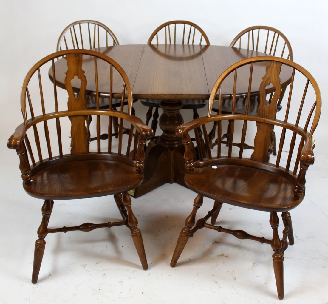 Oak pedestal base table with 5 Windsor back chairs: Oak pedestal base dining table with leaf & set of 5 Nihols & Stone Windsor back chairs. Table 30"h x 57"w, Chairs 37"h & 35 1/2"h