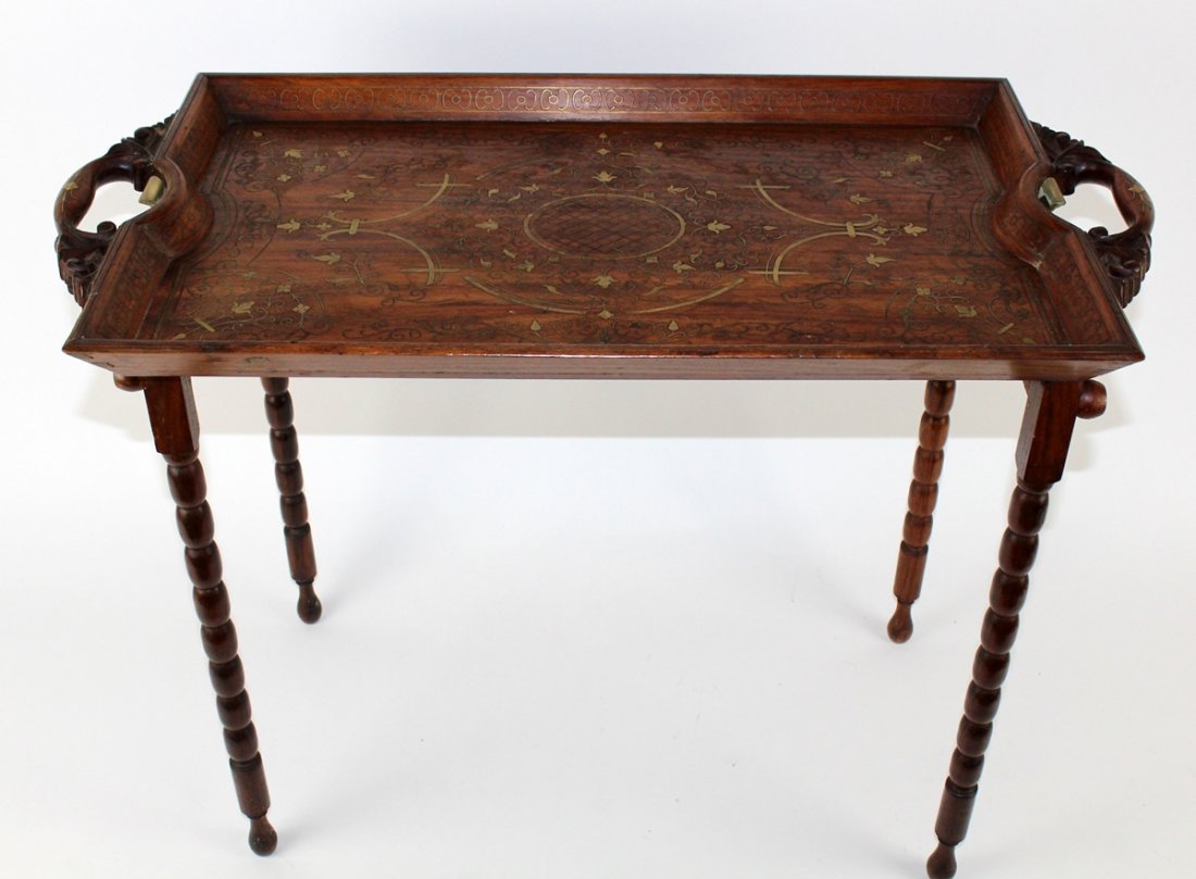 Rosewood butlers table with ornate brass inlay: Rosewood butlers table with ornate brass inlay. 22"h x 30"w