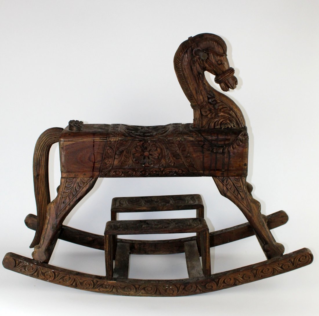 Carved mahogany rocking horse: Carved mahogany rocking horse. 30 1/2"h x 36"w x 13 1/2"d