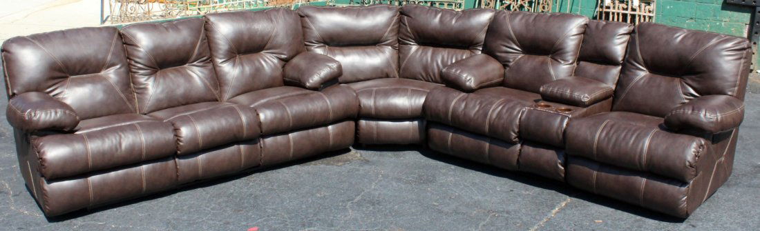 Brown leather sectional sofa: Brown leather sectional sofa. Sofa has 4 recliners integrated into it. Comes apart in 3 sections. 40"h x 114-120"l