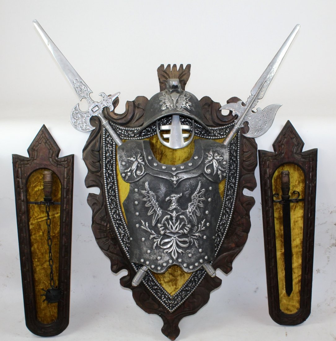 3 piece coat of arms with armory: 3 piece coat of arms with weaponry on carved wooden plaques, 50”h x 40”w and 34”h x 9”w