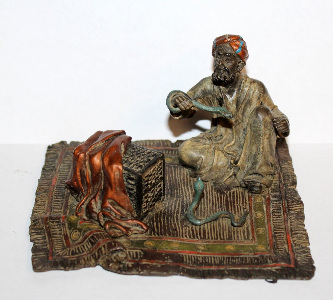 Cold painted bronze snake charmer (1 of 3)