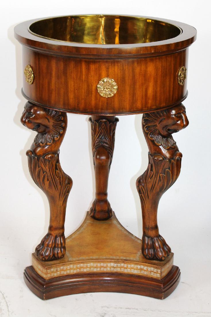 Maitland Smith mahogany champagne cooler: Maitland Smith mahogany champagne cooler. Brass lined basin supported by 3 griffin supports. 34"h x 22½" dia