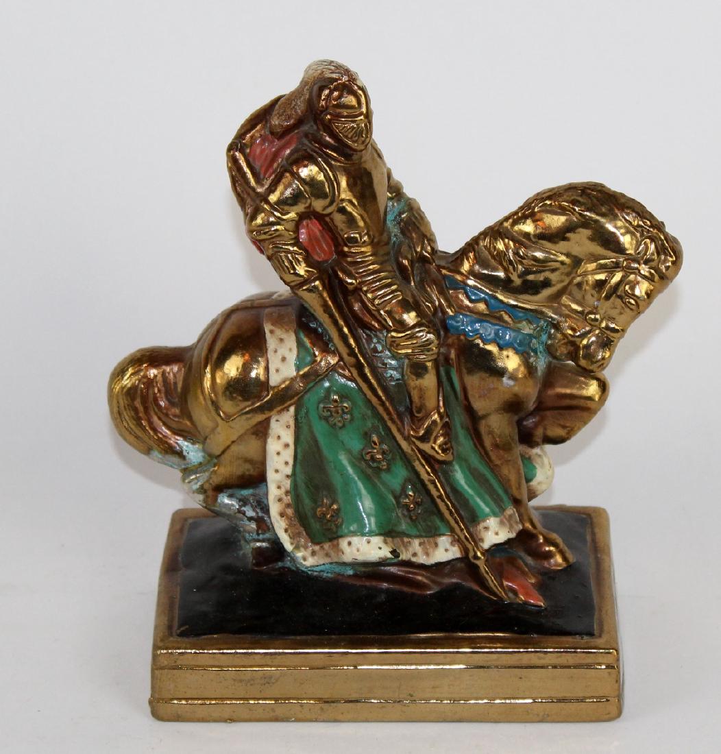 Bronze clad statue of knight on horseback (1 of 3)