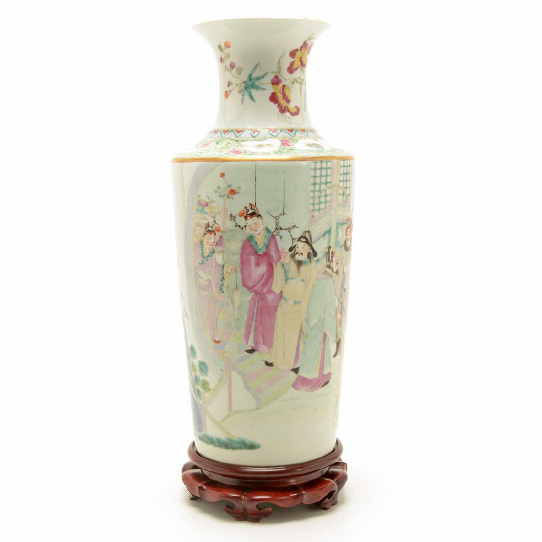 Famille Rose Enameled Vase, 19th Century: Famille Rose Enameled Vase With a trumpet neck and canted shoulder above an elongated body tapering inward above a short foot, painted with operatic characters in a courtyard. 19th Century {Height: 16