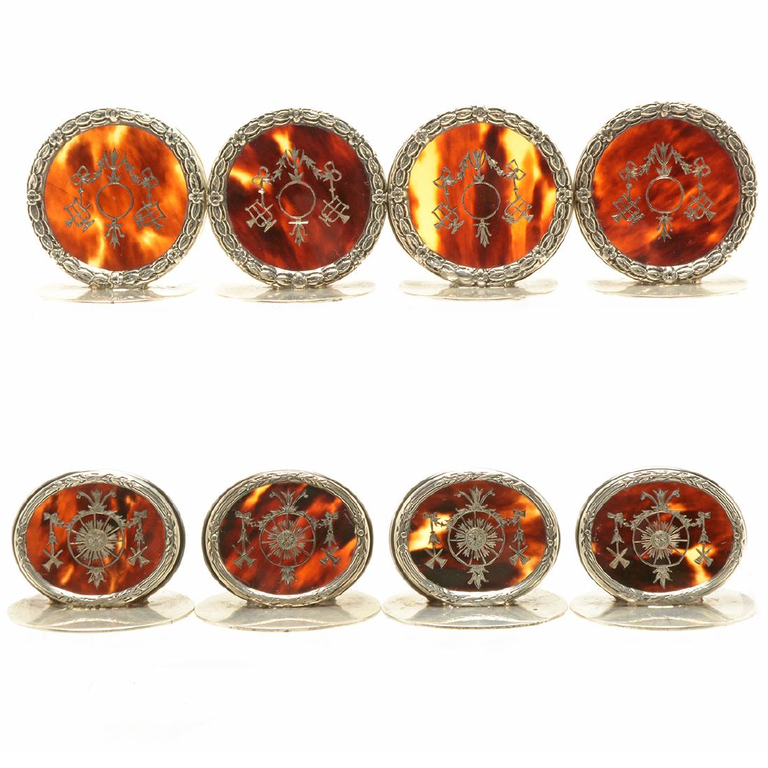 English Sterling Boulle Place Card Holders: English Sterling Boulle Place Card Holders Comprising eight place card holders of varying sizes, with a boulle silver inlaid plaque mounted in a silver garland base; all marked W.C. in a four tipped o