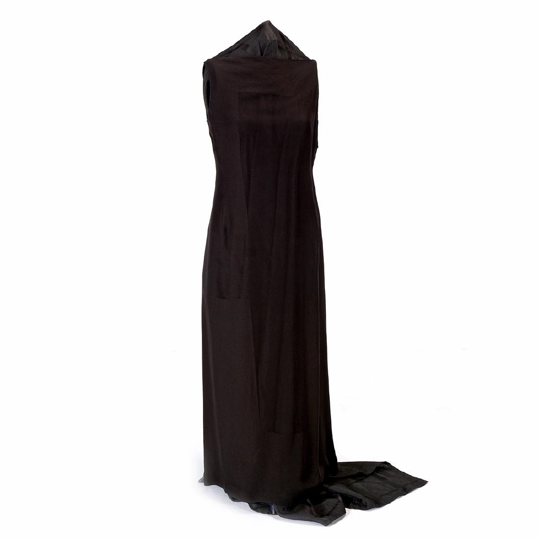 Evening Couture Gowns and a Suit: Evening Couture Gowns and a Suit A sleek black jet Chanel beaded sheath gown; a Bergdoff Goodman minimalist black sheath with black lace corset; a Michael Casey midnight blue sheath dress with Grecian