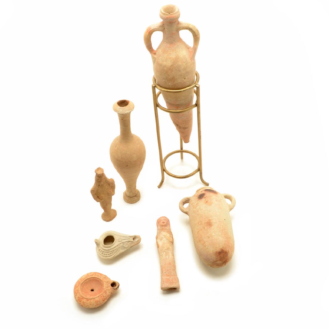 Mediterranean Terracotta Vessels and Figures: Mediterranean Terracotta Vessels and Figures Comprising an amphora wine transport vessel with two side handles {height 11 1/4 inches}, a bottle neck vessel, an alabastron perfume holder {height 6 1/2
