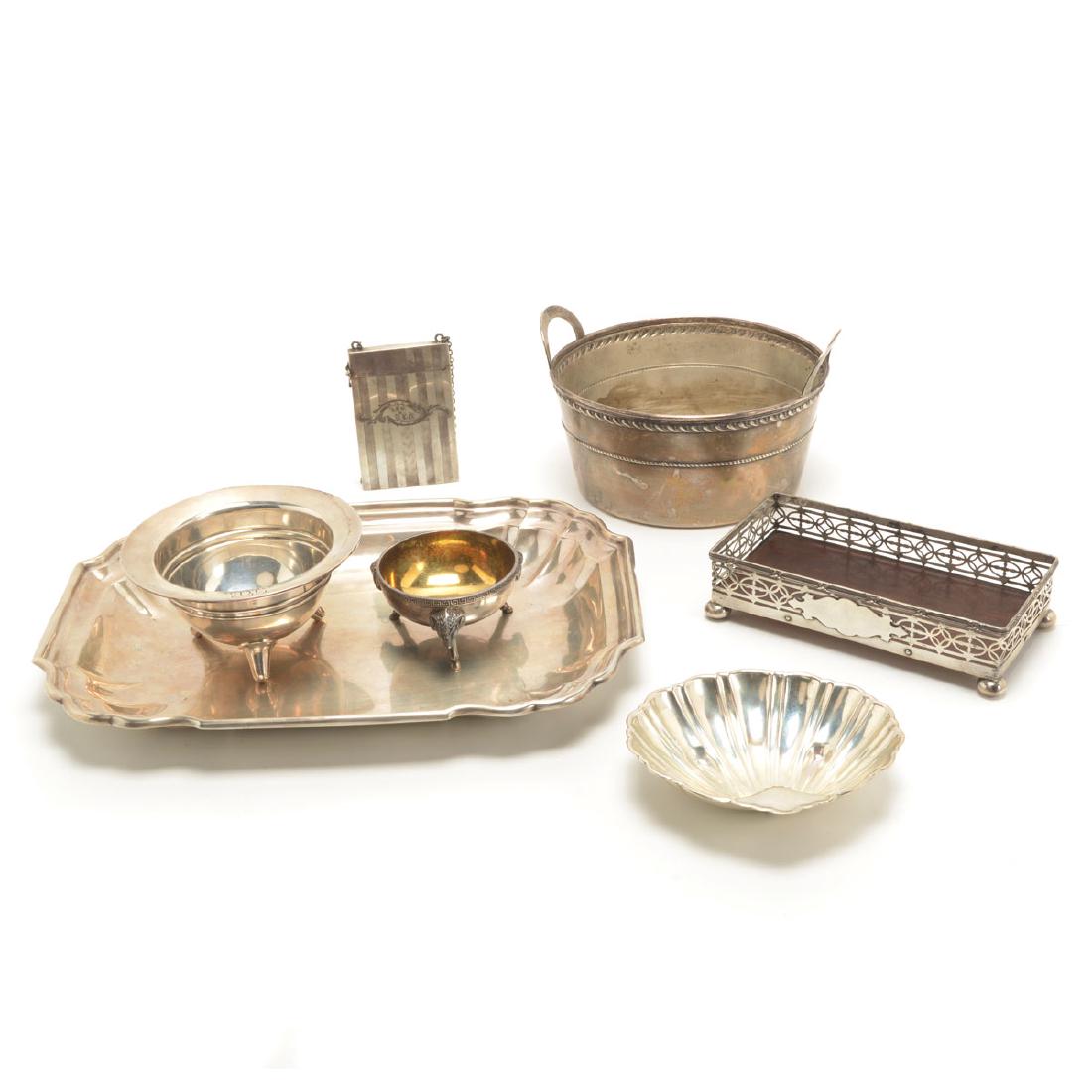 Collection of Sterling Hollowware: Collection of Sterling Hollowware Comprising a Tiffany tripod salt cellar, circa 1865, cast with goat heads and leitmotif border {diameter 3 1/4 inches}; a tripod monogrammed bowl; a shell tray; a Mer