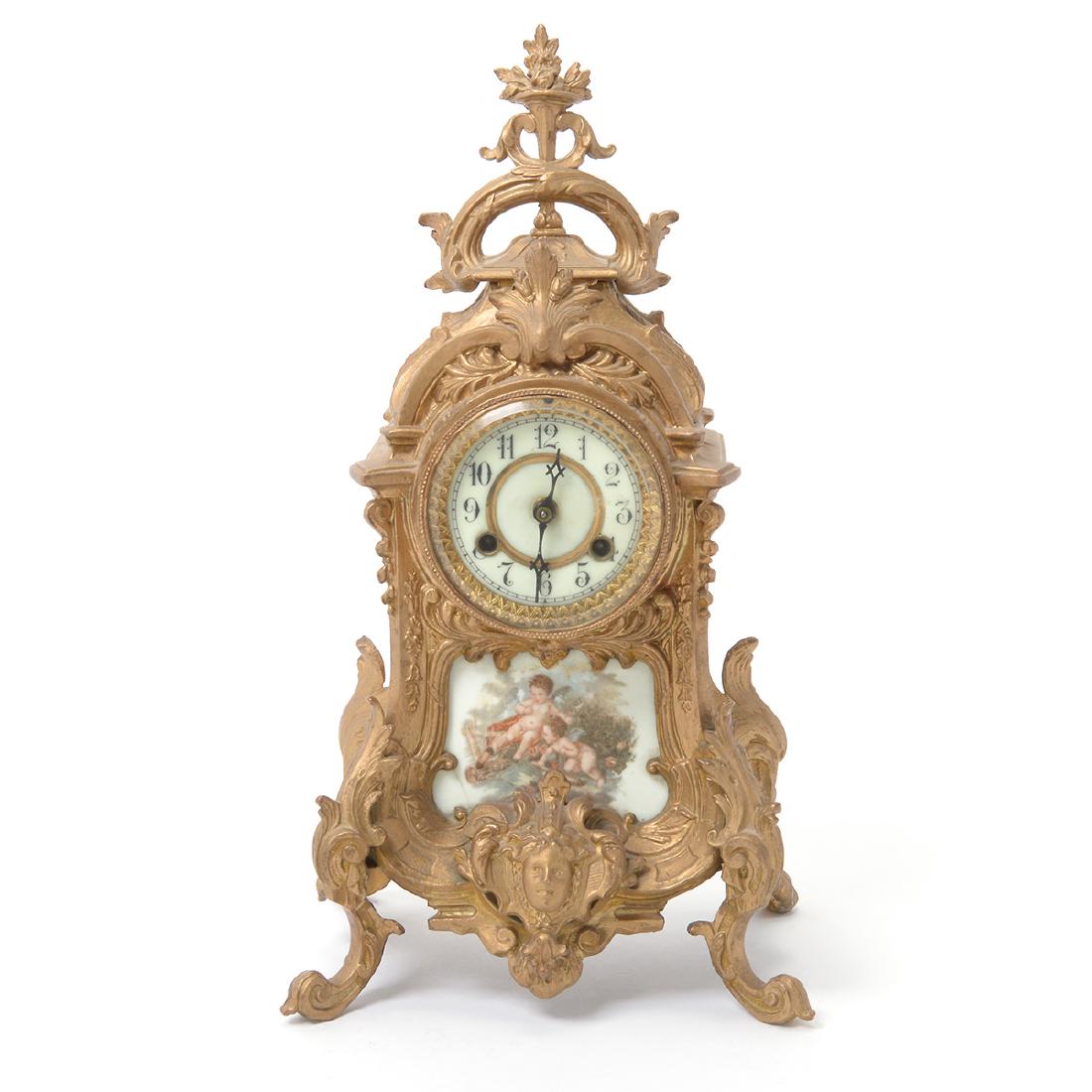 Louis XV Style Gilt Metal Clock with Porcelain Mount: Louis XV Style Gilt Metal Clock with Porcelain Mount Painted with Two Amorini {Height 16 inches}