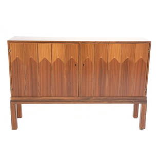 Eliel Saarinen, Credenza: Eliel Saarinen,Credenza. Doors with inlaid stylized linen fold design in contrasting woods. {Dimensions 39 3/4 x 59 x 14 1/2 inches}