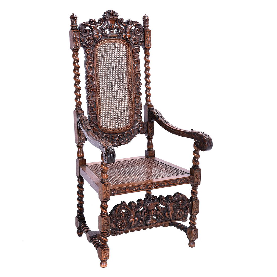 Oak Armchair with Caned Seat and Back: Oak Armchair with Caned Seat and Back. Heavily Carved Decoration Including Solomonic Columns, Scroll and Acanthus Carved Arms, Putti, Etc. {Dimensions approximately 54 x 26 1/4 x 23 3/4 inches}