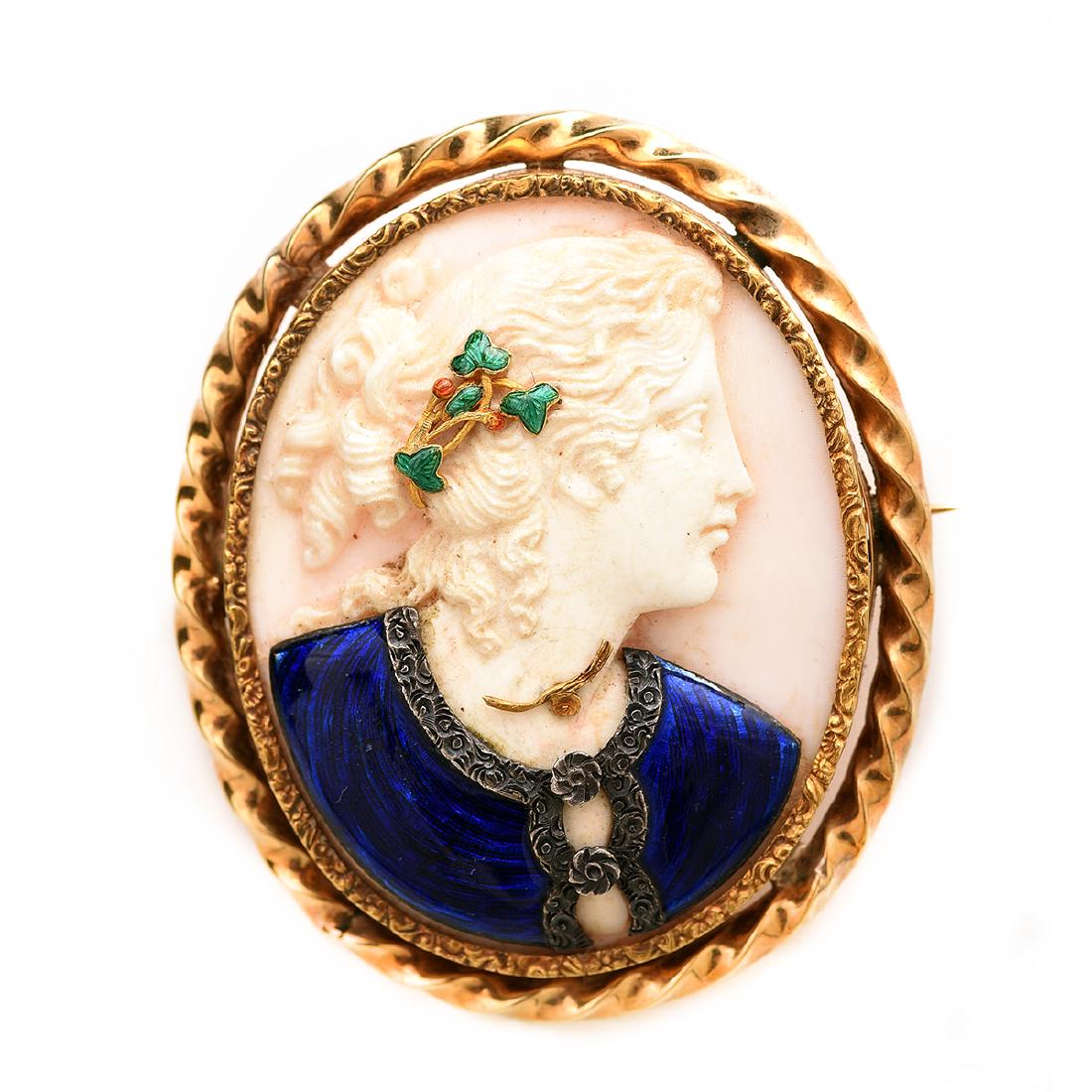 Shell Cameo, Enamel, 14k Yellow Gold, Silver-Topped: Shell Cameo, Enamel, 14k Yellow Gold, Silver-Topped Brooch. Featuring one shell cameo measuring approximately 39 x 31 mm, depicting the profile of a woman, her gown decorated with blue enamel and a si